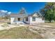 Charming white home with a new roof and freshly landscaped yard at 22 S Cherokee Ave, Fort Meade, FL 33841