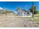 White home with a new roof and partially cleared yard at 22 S Cherokee Ave, Fort Meade, FL 33841