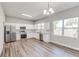 Modern kitchen with stainless steel appliances, white cabinets, granite countertops, and a subway tile backsplash at 22 S Cherokee Ave, Fort Meade, FL 33841