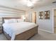 Bedroom featuring a wood bed frame, gray horizontal-striped accent wall, and carpet flooring at 2218 Oldham Ct, Haines City, FL 33844