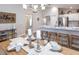 Dining area with island countertop seating, next to a modern kitchen design and decor at 2218 Oldham Ct, Haines City, FL 33844