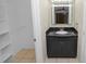 Modern bathroom with dark vanity, granite countertop, vessel sink, and large mirrored medicine cabinet at 2330 Creek Side Dr, Lakeland, FL 33811