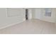 View of a neutral bedroom featuring tile floors and a blank, inset wall feature at 2330 Creek Side Dr, Lakeland, FL 33811