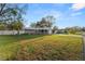 Well-maintained lawn and landscaping surround this cozy single Gathering home with a long driveway at 2330 Creek Side Dr, Lakeland, FL 33811