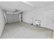 Spacious garage with concrete floor, utility sink, and garage door at 2330 Creek Side Dr, Lakeland, FL 33811