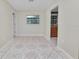 Bright living room featuring tile floors and a view into the kitchen at 2330 Creek Side Dr, Lakeland, FL 33811