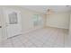 Bright living room featuring tile flooring, a ceiling fan, and a window for natural light at 2330 Creek Side Dr, Lakeland, FL 33811