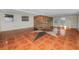 Bright living room featuring star-patterned tile floors and wood accent wall at 2330 Creek Side Dr, Lakeland, FL 33811