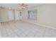 Spacious living room featuring tile flooring, ceiling fan, and neutral paint at 2330 Creek Side Dr, Lakeland, FL 33811