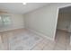 Bright living room featuring tile floors, large windows and neutral walls at 2330 Creek Side Dr, Lakeland, FL 33811