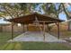 Backyard patio features a covered structure with a stone paver floor at 2330 Creek Side Dr, Lakeland, FL 33811