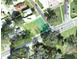 Aerial view of a residential lot on Mississippi Ave surrounded by mature trees and close to Lake Hollingsworth at 24 Lake Hollingworth Dr, Lakeland, FL 33803