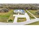 Expansive estate aerial view with a circular driveway and lush green surroundings at 275 Canterwood Ln, Mulberry, FL 33860