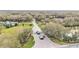 Aerial view of a gated community entrance with lush landscaping and water feature at 275 Canterwood Ln, Mulberry, FL 33860