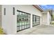 Close up view of the home's glass garage doors, highlighting modern design and ample natural light at 275 Canterwood Ln, Mulberry, FL 33860