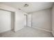 Spacious bedroom featuring neutral paint, gray tile floors and closet at 2926 Delrose N Dr, Lakeland, FL 33805