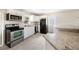 Updated kitchen featuring white cabinetry, stainless steel appliances and granite countertops at 2926 Delrose N Dr, Lakeland, FL 33805