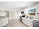 Eat-in kitchen boasts stainless appliances, granite countertops, and a window at 2926 Delrose N Dr, Lakeland, FL 33805