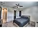 Bedroom featuring neutral walls, a ceiling fan, and a sliding barn door to the bathroom at 300 Lake Smart Cir, Winter Haven, FL 33881