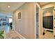 Hallway with decorative rug and view of the living room and bathroom at 300 Lake Smart Cir, Winter Haven, FL 33881