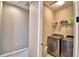 This is a laundry room with a modern washer and dryer at 300 Lake Smart Cir, Winter Haven, FL 33881