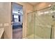 Walk-in shower with a glass door, and views to bedroom at 300 Lake Smart Cir, Winter Haven, FL 33881