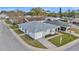 Aerial view of a home featuring a well maintained roof and a lush front lawn at 3102 Pebble Bend Dr, Lakeland, FL 33810