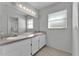 Bathroom features dual sinks, large mirror, and good lighting at 3102 Pebble Bend Dr, Lakeland, FL 33810