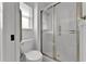 Bathroom showcases toilet and shower with clear glass door at 3102 Pebble Bend Dr, Lakeland, FL 33810