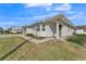 View of a well-maintained single-story home with attached carport and lawn at 3102 Pebble Bend Dr, Lakeland, FL 33810