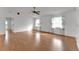 Bright living room featuring hardwood floors and large windows at 3102 Pebble Bend Dr, Lakeland, FL 33810