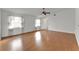 Spacious living room featuring wood floors, neutral walls, and lots of natural light at 3102 Pebble Bend Dr, Lakeland, FL 33810