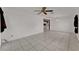 Open living area with tile flooring and a view into the kitchen at 3102 Pebble Bend Dr, Lakeland, FL 33810