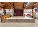 Entertainment stage with podium, curtain and adjacent gathering area at 3102 Pebble Bend Dr, Lakeland, FL 33810