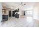 Open-concept kitchen with black appliances, wood countertops, tile floor and plenty of light at 320 E Daughtery Rd, Lakeland, FL 33809