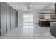 Tiled kitchen and living area featuring floating shelves and access to outdoor patio at 320 E Daughtery Rd, Lakeland, FL 33809