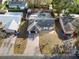 Aerial view of charming single-Gathering home with a private, screened-in pool and mature trees at 327 Corona Del Mar St, Lakeland, FL 33809