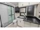 Beautiful bathroom with a glass shower, white subway tile, and a vanity with black accents at 327 Corona Del Mar St, Lakeland, FL 33809