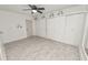 This bright bedroom offers updated flooring, a ceiling fan, and a spacious closet with sliding doors at 327 Corona Del Mar St, Lakeland, FL 33809