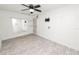 A versatile room with updated flooring, a ceiling fan and a wall mirror, perfect for a home gym or studio at 327 Corona Del Mar St, Lakeland, FL 33809