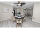 Dining room with neutral color palette with views to front entry and living space at 327 Corona Del Mar St, Lakeland, FL 33809