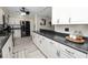 Kitchen features sleek, modern appliances, ample countertop space and white cabinets at 327 Corona Del Mar St, Lakeland, FL 33809