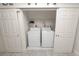 This home features a convenient laundry area tucked behind sliding doors at 327 Corona Del Mar St, Lakeland, FL 33809