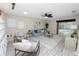 Bright living room featuring modern decor, and sliding glass doors to the pool area at 327 Corona Del Mar St, Lakeland, FL 33809