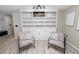 Cozy living room with built-in shelving, comfortable seating, and stylish decor at 327 Corona Del Mar St, Lakeland, FL 33809