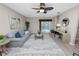 Spacious living room features neutral tones, modern furnishings, and sliding glass doors to the pool area at 327 Corona Del Mar St, Lakeland, FL 33809