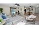 Inviting living room showing open layout, modern decor, and seamless flow to kitchen and pool at 327 Corona Del Mar St, Lakeland, FL 33809