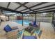 Enjoy the outdoors on this screened patio with a beautiful view of the pool and a comfortable seating area at 327 Corona Del Mar St, Lakeland, FL 33809