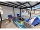 Comfortable patio seating area with modern furniture and stylish decor, perfect for outdoor entertaining and relaxation at 327 Corona Del Mar St, Lakeland, FL 33809