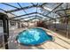 Beautiful enclosed in-ground pool with a spacious deck, creating a private retreat for relaxation and enjoyment at 327 Corona Del Mar St, Lakeland, FL 33809
